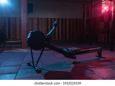 Simulation Rowing Exercise Machine In Red Blue Neon Gradient Light