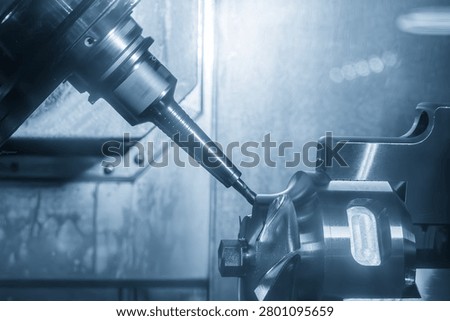 The simultaneous multi-axis machining process in the production of high-performance automotive parts and engine components.