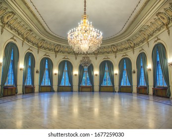Sinaia, Romania - October 30, 2019: Big castle dancind room with candelabra in th middle. Castle interior. Empty room