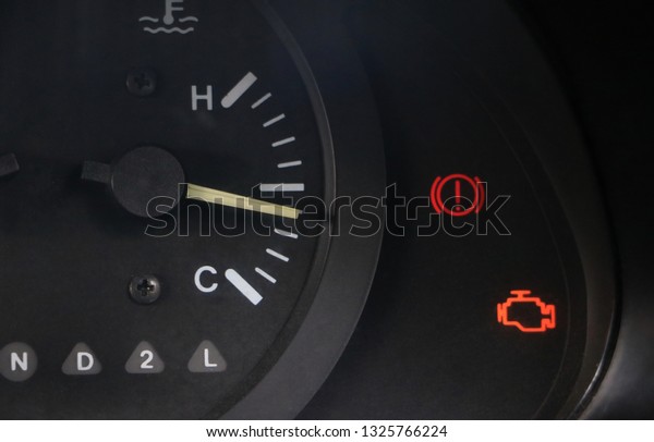 Sing and symbol on car\
dashboard