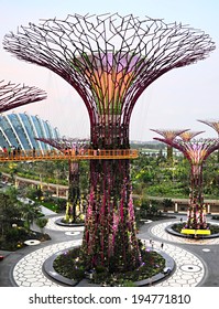 SINGAOPE -  MARCH 05, 2013: People Walking On The Bridge At Gardens By The Bay At Dusk. Gardens By The Bay Was Crowned World Building Of The Year At The World Architecture Festival 2012