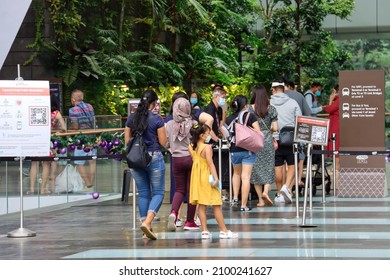 SINGAPORE - 1 JAN 2022: Jewel Changi Airport's visitors are checked for FULL Covid-19 vaccination status before being allowed entry. Outings promote mental well-being amid Covid-19 curbs. 