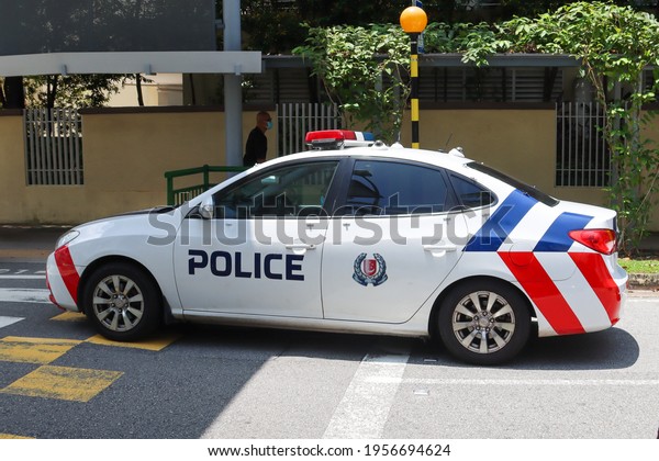 SINGAPORE - 13 APR 2021. A Singapore Police Force\
saloon patrol car at Tiong Bahru shopping Mall.   By 2024, saloon\
cars will be replaced by purpose-built Hyundai Tucson sports\
utility vehicles SUV.