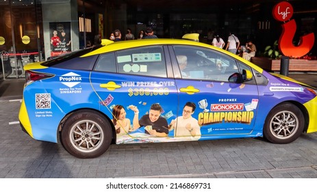 SINGAPORE - 14 APR 2022: Vehicle Wrap Adverts For A Top Realty Company PROP NEX In A Taxi Creates Awareness Of Its Presence And Aids Recruitment Of Agents.  