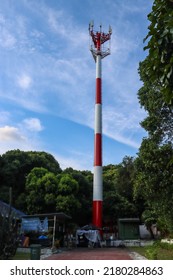 SINGAPORE - 17 JUL 2022: Singtel Monopole Telecommunication Tower In Whitley Road For Cell Phone Transmission. A Monopole Tower Is A Kind Of Tower That Consists Of One Pole Anchored To The Ground.