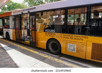 SINGAPORE - 17 OCT 2022: Vehicle Wrap Advertisements Of Employment Rights To A Maximum Of 72 Hours Overtime Are Effective Mobile Adverts. They Are Cheaper Than Painting Artwork Onto The Public Bus.