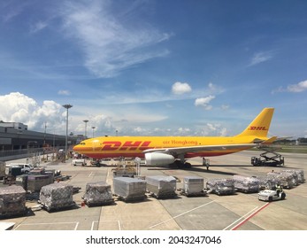 Singapore, 18 September 2021: DHL Airline parking at Singapore Changi Airport waiting for cargo flight during Covid - 19 pandemic.