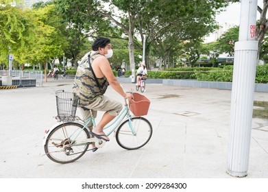 Singapore - 1st January 2021: A Cyclist Is Cycling In The City.