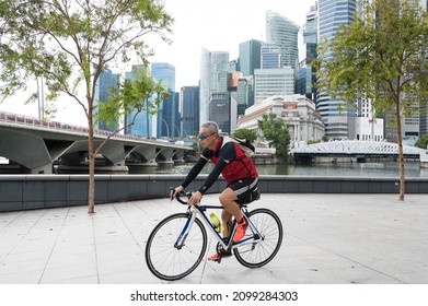 Singapore - 1st January 2021: A Cyclist Is Cycling In The City.