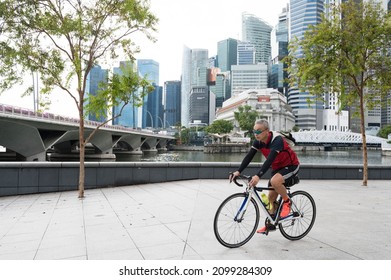 Singapore - 1st January 2021: A Cyclist Is Cycling In The City.