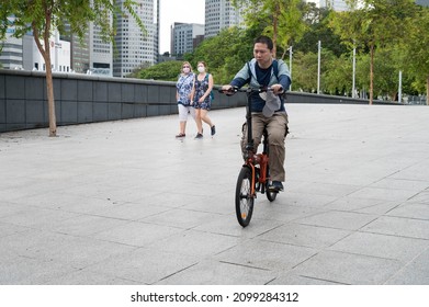 Singapore - 1st January 2021: A Cyclist Is Cycling In The City.