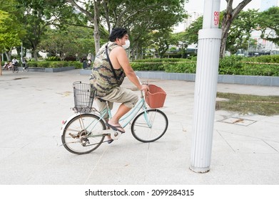 Singapore - 1st January 2021: A Cyclist Is Cycling In The City.