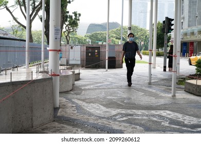 Singapore - 1st January 2021: A Man Is Walking In The City.