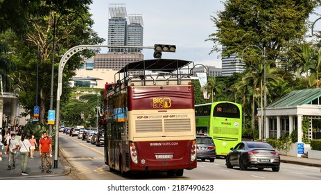 SINGAPORE - 2 AUG 2022: An open top bus with tourists in Orchard Road. Big Bus Tours is the largest operator of open top bus sightseeing tours in Singapore and many countries. 