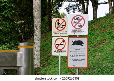 SINGAPORE - 2 OCT 2022: NParks' Advisories To Visitors Of Lower Pierce Reservoir About No Smoking, Dog On Leash, No Flying Of Model Aircraft And Wild Boar Encounters.