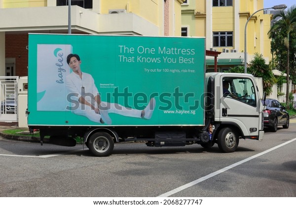 SINGAPORE - 2 SEP 2021: Vehicle wrapping advertisements\
on a truck delivering mattresses are effective outdoor mobile\
billboard adverts. They are much cheaper than painting artwork onto\
the truck.  