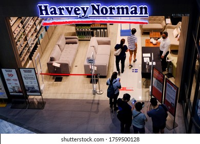 Singapore 2020Jun19 Covid-19 Phase 2 Re-opening Day. Shoppers Visiting Harvey Norman Retail Store, Staff Watching Them Scan Entry Code For Safe Entry; Social Distancing Safety Measures; Top Down Shot