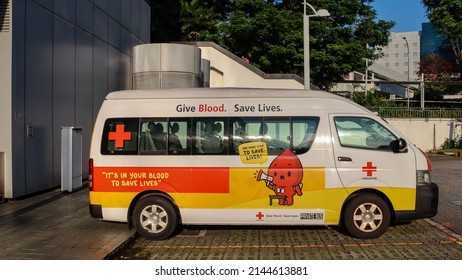 SINGAPORE - 22 MAR 2022: Vehicle Wrap Advertisements Of Blood Donation In A Red Cross Van Create Awareness Of The Need Of Blood Transfusions During Surgeries And Treatment Of Illnesses.