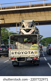 SINGAPORE - 28 SEP 2022. A South Asian Migrant Worker In Construction Companies Like Gennal Industries Is Usually Transported In A Truck. Some Activists Advocate Seat Belts For His Safety.