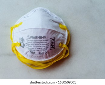 SINGAPORE, 29 JAN 2020 - 3M N95 respirator face mask on a white background – a heavy-duty protective mask designed to filter out 95% of airborne particles. With copy space.