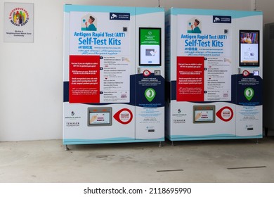 SINGAPORE - 3 FEB 2022: A  Vending Machine In The Void Deck Of Blk 106 Kebun Bahru HDB Flat Dispenses Covid-19 ART (Antigen Rapid Test) Kits To Singapore Residents To Self-test For Viral Infections.