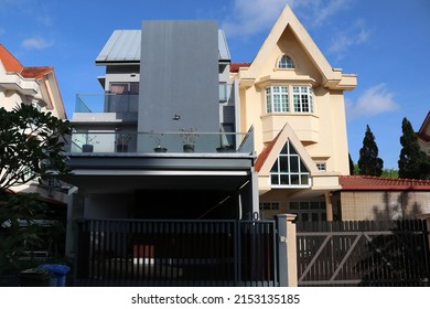 SINGAPORE - 6 MAY 2022: Lentor Villas. RECONSTRUCTED semi-detached house (L) commissioned by the new owner. The other house (R) has the original pointed roof and car porch design of over 30 years ago.