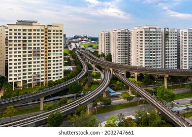 Singapore - 6Jun2021: Aerial shot of Punggol LRT Tracks and station amidst HDB flats in the neighbourhood to transport people back home. Many amenities in the neighbourhood.