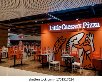 SINGAPORE – 9 APR 2020 – Stacked Chairs At A Closed Section Of Little Caesar’s Pizza Restaurant In Thompson Plaza. Only Takeaway Is Allowed Due To Covid-19 / Coronavirus Circuit Breaker Measures