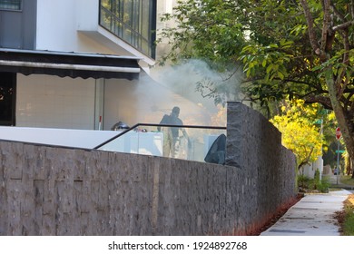 SINGAPORE – 9 FEB 2021: Mosquito Fogging Is Being Carried Out In A Lentor House. Breeding Of The Aedes Aegypti Mosquitoes Which Spreads The Dengue Virus May Be Prevented By The 5-step Mozzie Wipeout. 