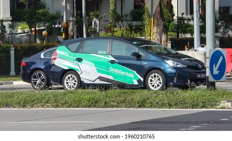 SINGAPORE - 9 JUN 2021: GrabRentals Has The Largest Private-hire Car Rental Fleet In Singapore. Hirers Must Be At Least 21 Years Old And Possess A Driver's Licence Of At Least 2 Years.