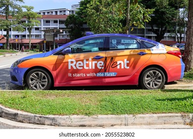 SINGAPORE – 9 OCT 2021: ComfortDelGro is the largest taxi operator renting taxis to drivers. Car wrapping advertisement displays generate additional income amid lower income due to Covid-19 pandemic.