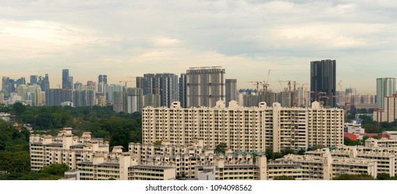 Singapore apartment housing real estate boon with construction cranes cityscape panorama - Shutterstock ID 1094098562
