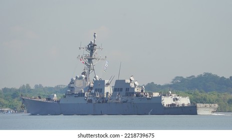 SINGAPORE - APRIL 14, 2022: USS Momsen (DDG-92), An Arleigh Burke-class Destroyer Transit The Straits Of Johor.