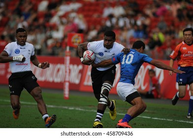 SINGAPORE - APRIL 16,2016 : Fiji 7s Rugby Team (white) Plays Against Samoa At HSBC World Rugby Sevens Series Singapore.