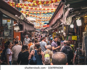 Singapore - April 2, 2018: China Town Strees In Singapore. People Walking Around Chinese Market