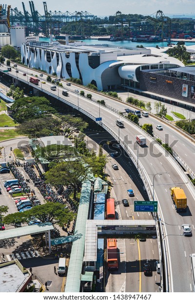 Singapore, April, 2019. View of the highway seen
from Singapore Cable Car. Singapore Cable Car opened on 15 February
1974, it was the first aerial ropeway system in the world to span a
harbour.