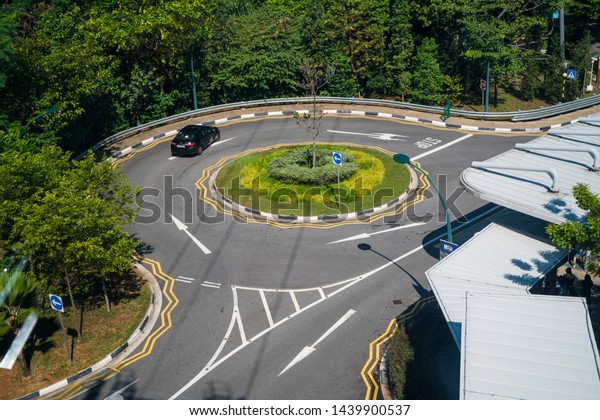 Singapore, April, 2019. View of the road seen\
from the Singapore Cable Car. Singapore Cable Car opened on 15\
February 1974, it was the first aerial ropeway system in the world\
to span a harbour.