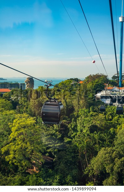 Singapore, April, 2019. Way to Sentosa station\
by taking Singapore Cable Car. Singapore Cable Car opened on 15\
February 1974, it was the first aerial ropeway system in the world\
to span a harbour.