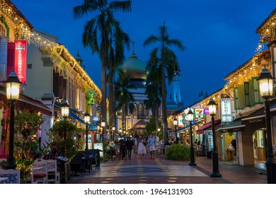 Singapore - April 2021: Illuminated Arab street and Sultan Mosque at Kampong Glam, Singapore