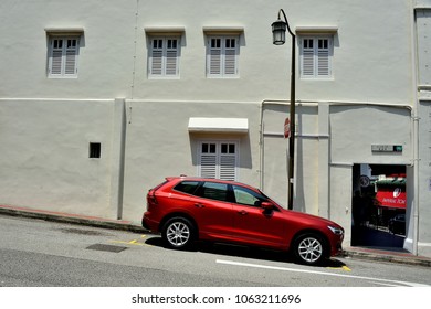 Singapore - April 4th 2018: Red Car Parked On Slope Outside An Old Shop House With Vintage Street Lamp In The Fashionable Bar And Restaurant Area Of Club Street   