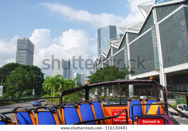 SINGAPORE - AUG 4: Sightseeing\
modern city bus explores city centre, August 4, 2009 in Singapore.\
Prior to independence in 1965, Singapore was a vibrant trading\
port