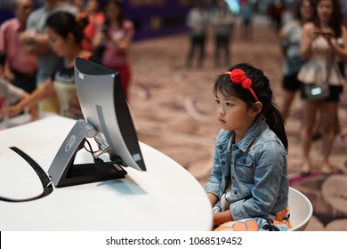 Singapore - August 12 2017: Concentration At Its Best. A Kid Watching TV.