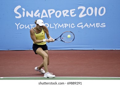 SINGAPORE - AUGUST 17: A Slovakian Player Jana Celepova Hits The Ball Back To Her Opponent During Round 2 Of The Singapore 2010 Youth Olympic Games Tennis Girls Singles On August 17, 2010 In Singapore