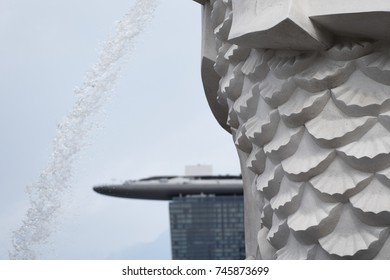 SINGAPORE - AUGUST 2017: Closeup Of The Merlion Statue And The Modern Architecture Of Marina Bay Sands.