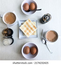 singapore breakfast, kaya toast bread and half boiled eggs paired with coffee or tea - Shutterstock ID 2174232425