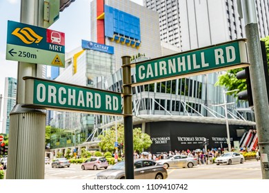 SINGAPORE CITY, SINGAPORE - OCTOBER 09, 2016:  A street sign at the junction of Orchard Road and Cairnhill Road in central Singapore.  Orchard Road is a busy retail street with upmarket stores.