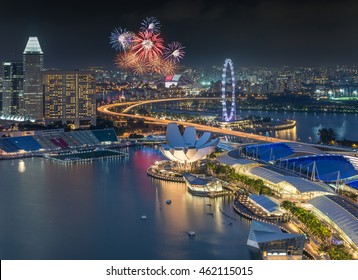 Singapore City Skyline Aeria Viewl With Firework During Twilight Time In Singapore National Day 