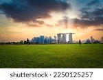 Singapore city Skyline and view of skyscrapers on Marina Barrage at sunset.