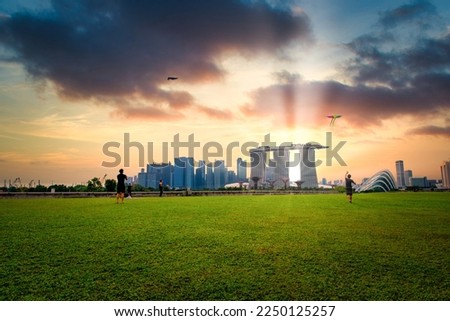 Singapore city Skyline and view of skyscrapers on Marina Barrage at sunset.