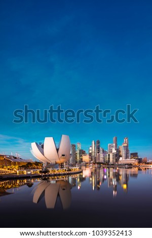 Singapore cityscape at dusk. Landscape of Singapore business building around Marina bay. Modern high building in business district area at twilight. 
